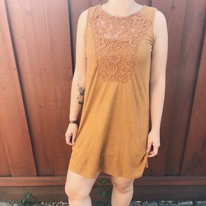 Yellow mini dress with embroidered design .